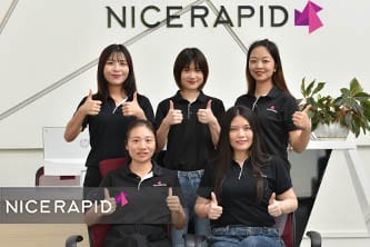 NICE Rapid Tooling team members collaborating in a modern manufacturing facility